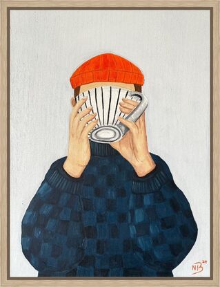 Person with scarf drinking coffee