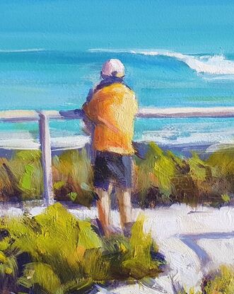 A figure stands overlooking a summer beach and feels good about life