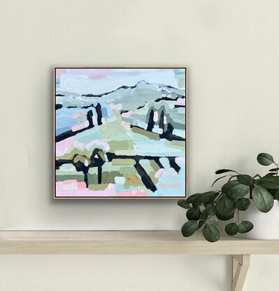 Small framed canvas with a textured landscape scene in pastel tones, orange, pinks, greens and blues abstract hills, trees and foliage shapes chunky paint with visible big brushstrokes.