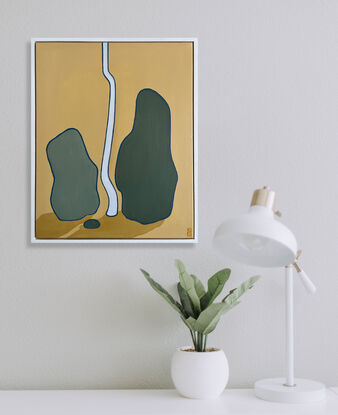 Green boulders with vertical tree trunk on ochre base