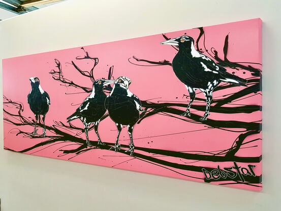 4 magpies sitting on a branch pink