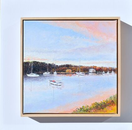 Oil painting of boats on the Clarence River at Yamba (NSW). It is sunset and the clouds are a soft orange