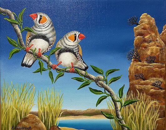 In the foreground are 2 zebra finches on a single branch. The background depicts a waterhole with high barren rocks and grass. It is all set to a background of a dark blue sky.