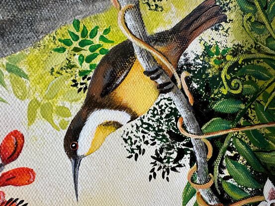 Two Honey Eaters are feeding in a red flowering tree. There is lots of green foliage against a soft golden sky