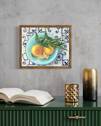 2 oranges and 2 wedges of orange on turquoise plate with tiled background