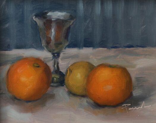 An original oil painting of a silver goblet and oranges.