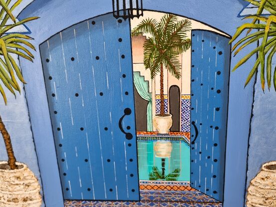 Quintessential image of Chefchaouen Morocco with large arched timber door, heavy plaster walls, aged and worn pots and cobblestone - blue of course.  The opened door provides a peek into the courtyard of the Riad acccommodation with its gorgeous aqua pool reflecting the arched architecture.