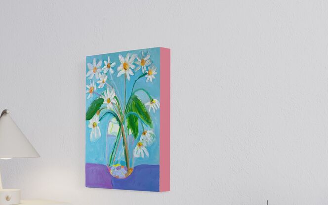 Garden daisy’s in glass vase with blue  background. Relaxing and peaceful scene 