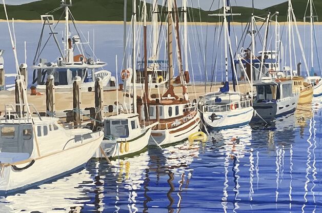 Sunny winter day, depicting fishing boats and yachts, and their reflections, tied up to a jetty.