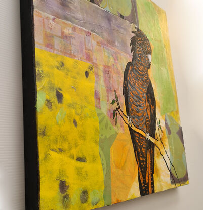 This art work was a finalist in the Lethbridge Small Scale Art Award 2024.
The Black Cockatoo was created using acrylic paint and for the background, Suanne used acrylic, collage paper and mixed media. 
