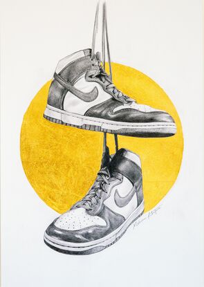 A graphite balck and white drawing of two Nike Dunk high top shoes hanging from their shoe laces from height reminiscent of telegraph wires. Behind the shoes is a gold metallic halo. 