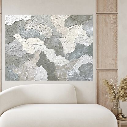 Thick clouds of lightweight plaster overlap each other to created a cloud-like affect. Each cloud is in a shade of beige, sage and olive.