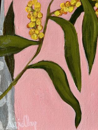 A colourful happy painting of wattle hanging over collaged gum and a pink background. Lots of pops of yellow to brighten up your day. 