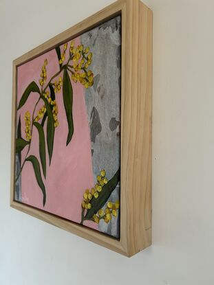 A colourful happy painting of wattle hanging over collaged gum and a pink background. Lots of pops of yellow to brighten up your day. 