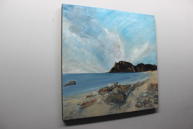 Majestic painting of a beach with a calm bay and a mountainous backdrop and awesome sky