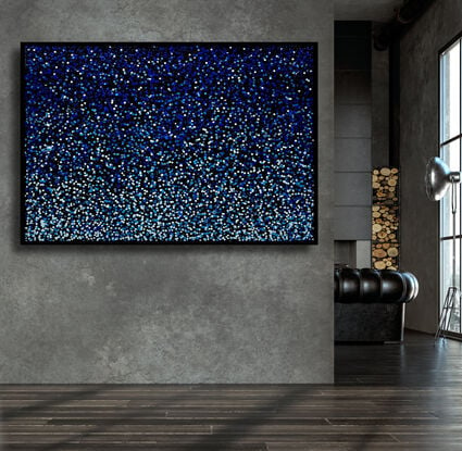 vibrant blue dots dropped onto black canvas