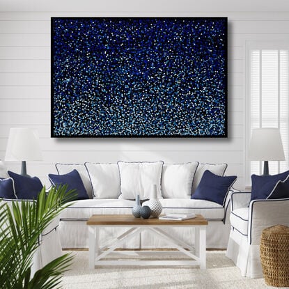 vibrant blue dots dropped onto black canvas