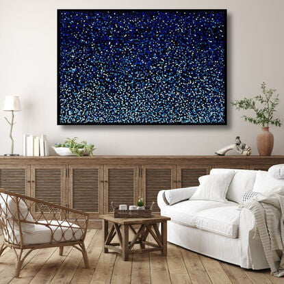 vibrant blue dots dropped onto black canvas