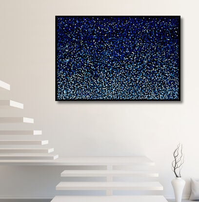 vibrant blue dots dropped onto black canvas