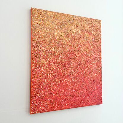 A red, orange, and yellow abstract dotted painting.