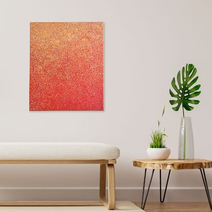 A red, orange, and yellow abstract dotted painting.