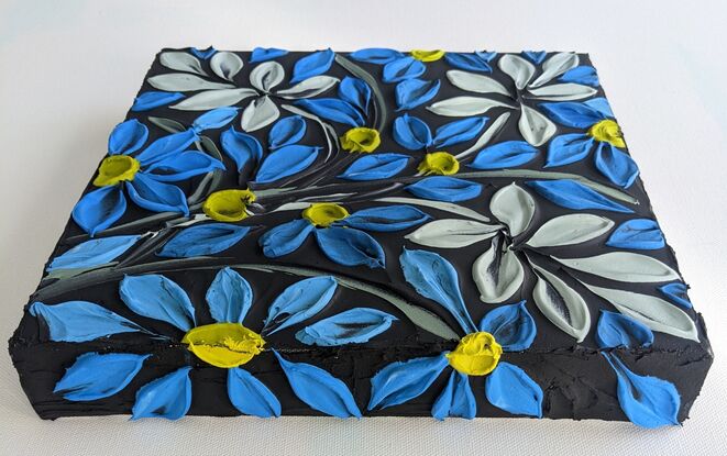 textured acrylic floral in vivid blue and lime yellow on a textured  black background