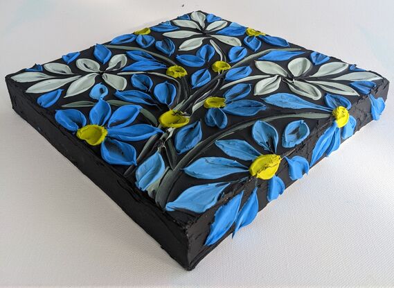 textured acrylic floral in vivid blue and lime yellow on a textured  black background