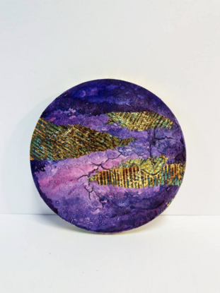 three circular abstract paintings in shades of pink and purple with elements of variegated gold