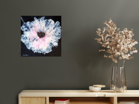 A single white and pink delicate flower on black nara paper done with ink.