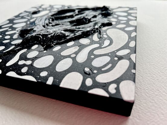 Black and white patterns express a yin yang nature of duality and polarity. Textured three dimensional acrylic jumps out of the artwork and begs to be touched.  