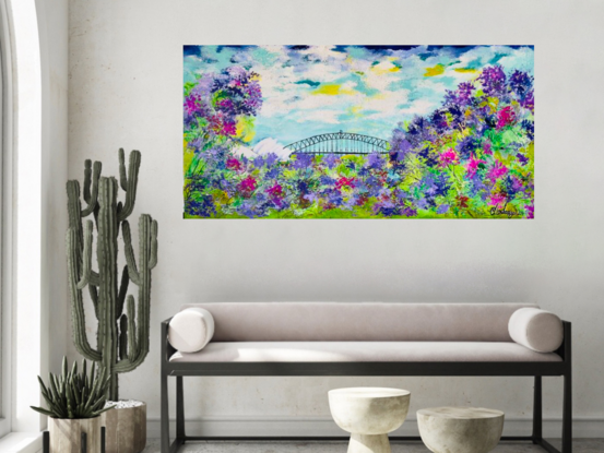 The painting depicts a mesmerizing landscape of botanic Australiana, showcasing colorful jacarandas in full bloom against a backdrop of Sydney Harbour Bridge and Opera House. The textured canvas brings the scene to life, capturing the intricate details of the florals and the iconic landmarks. The vibrant hues of the jacarandas contrast beautifully with the cloudy sky, creating a dreamy and enchanting atmosphere. This artwork effortlessly conveys the rich beauty and tranquility of nature intertwined with urban architecture, inviting viewers to immerse themselves in the serene charm of this picturesque setting.
Colours used cool yellow, light green, dark green, textured canvas , painted with a palette knife , black white mixed blues ‘
Comes with a certificate Of Authenticity 
Canvas is varnished for easy cleaning and ready to hang 