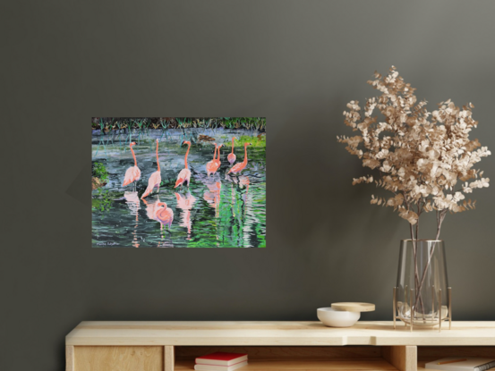 Flamingo Reflections is a painting depicting a group of Flamingos wading in water, surrounded by lush greenery and their reflections. I’ve given it an exotic and lively feel with the use of bright colours and tropical theme.