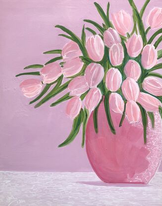 A vase of pink tulips.