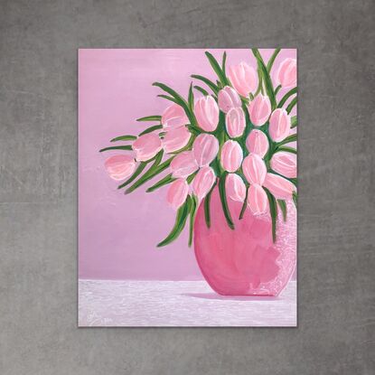 A vase of pink tulips.