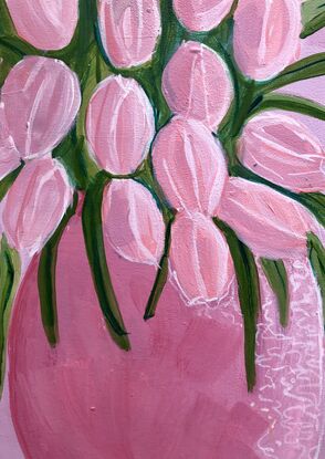 A vase of pink tulips.