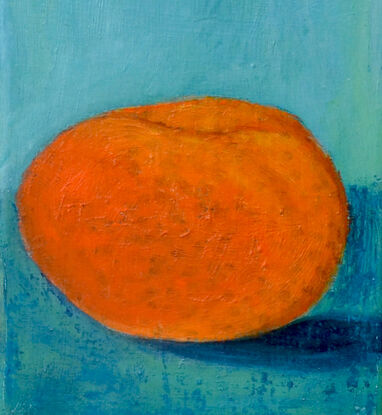 orange mandarine on turquoise bench