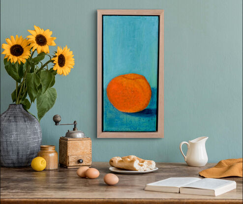 orange mandarine on turquoise bench