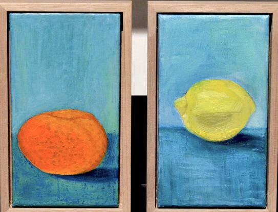 orange mandarine on turquoise bench