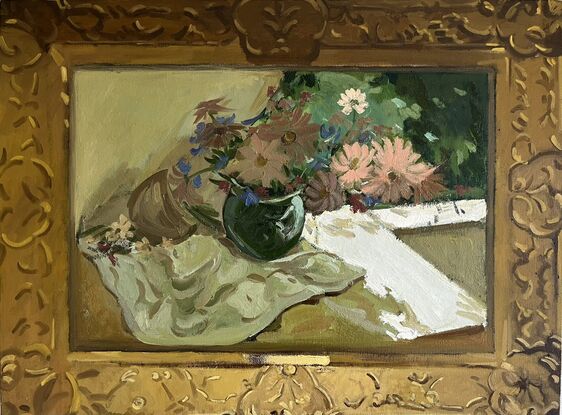 Pink and cream flowers in green vase