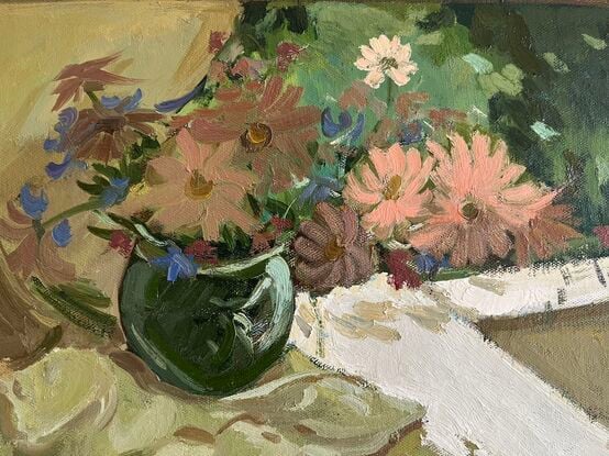 Pink and cream flowers in green vase