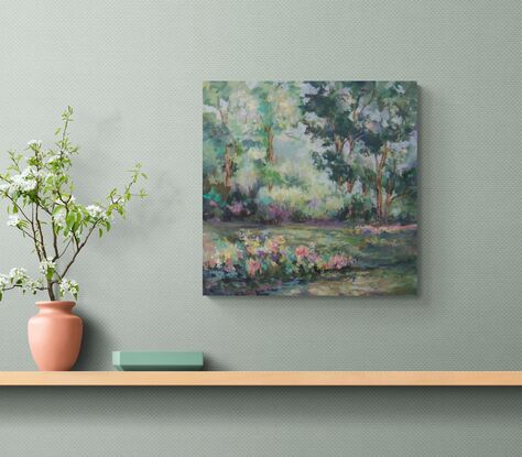 Soft hues of green and blue blend to depict a serene forest scene with vibrant patches of flowers. Dappled light filters through the dense foliage, creating a tranquil and picturesque landscape.