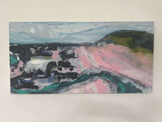 A pink beach, a loosely painted creek, heading through rocks to the ocean. A headland a suggestion of, deep water and land further on. It is a loose abstracted artwork. 