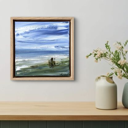 Beach sand tree blue sky and sea green banks 