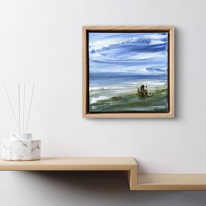 Beach sand tree blue sky and sea green banks 