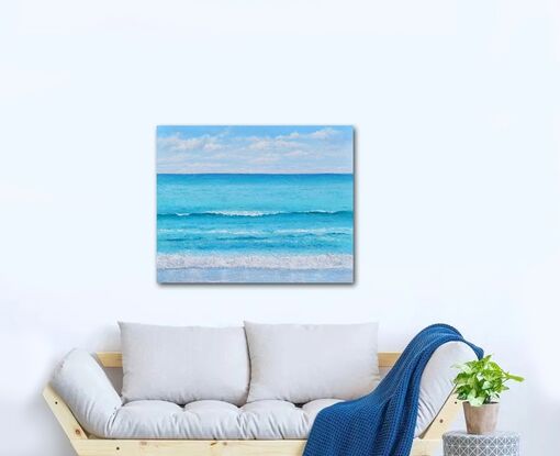 Painting of a turquoise blue ocean and fluffy white clouds in the early morning summer sunshine.