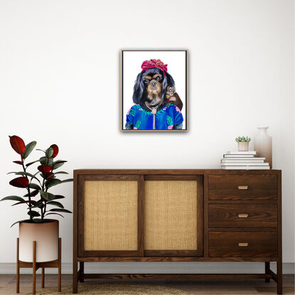 Cavalier King Charles spaniel painted in the likeness of Frida Khalo. 