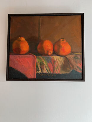 Painting of three tangellos on a shelf painted in warm oranges, venetian red, ochres and raw umber.