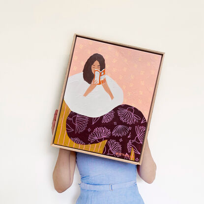 Blue background, woman reading book