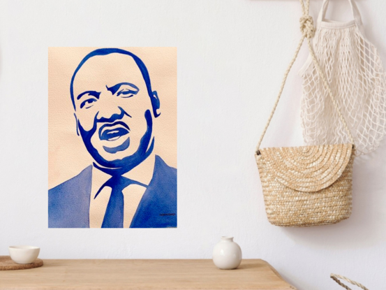 "A Vision of Unity" by Christine Beard is a powerful watercolor portrait of Martin Luther King Jr., rendered in a striking blue monochrome palette. This minimalist yet bold portrayal captures the essence of the iconic civil rights leader, emphasizing his enduring impact on social justice and leadership. The artwork serves as an inspiring tribute, inviting viewers to reflect on King's legacy and the ongoing struggle for equality. This piece stands as a timeless reminder of the strength and resilience embodied by one of history's most influential figures.





