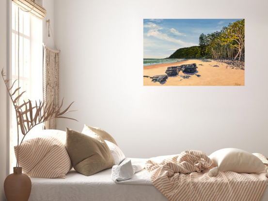 Tea Tree Bay Noosa National Park beach with coffee rocks, the ocean, sand, tea trees and sky.